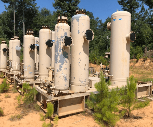 Recovered industrial pressure vessels prepared for material recycling and responsible metal processing.